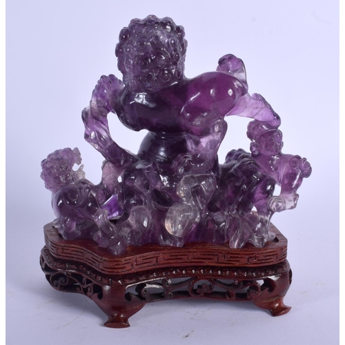 1839 - AN EARLY 20TH CENTURY CHINESE CARVED AMETHYST FIGURE OF A BUDDHISTIC LIONS Late Qing/Republic. Ameth... 