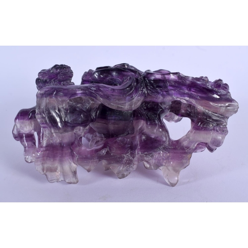 1839 - AN EARLY 20TH CENTURY CHINESE CARVED AMETHYST FIGURE OF A BUDDHISTIC LIONS Late Qing/Republic. Ameth... 