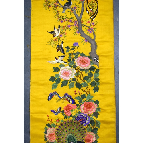 1849 - A LONG 19TH CENTURY CHINESE YELLOW SILK EMBROIDERED PANEL Qing, decorated with hundreds of birds wit... 