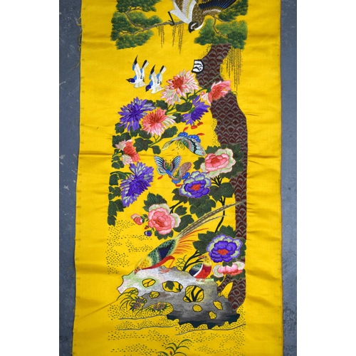 1849 - A LONG 19TH CENTURY CHINESE YELLOW SILK EMBROIDERED PANEL Qing, decorated with hundreds of birds wit... 