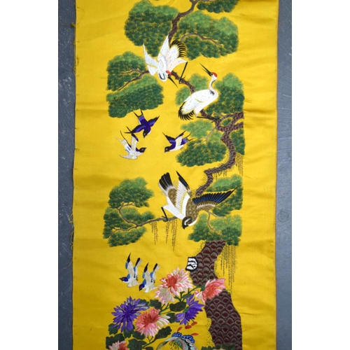 1849 - A LONG 19TH CENTURY CHINESE YELLOW SILK EMBROIDERED PANEL Qing, decorated with hundreds of birds wit... 