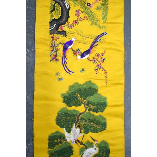 1849 - A LONG 19TH CENTURY CHINESE YELLOW SILK EMBROIDERED PANEL Qing, decorated with hundreds of birds wit... 