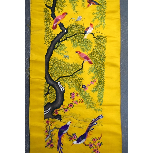 1849 - A LONG 19TH CENTURY CHINESE YELLOW SILK EMBROIDERED PANEL Qing, decorated with hundreds of birds wit... 