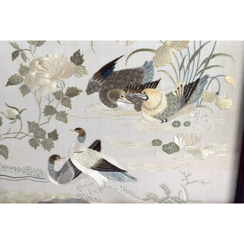 1853 - A LARGE 19TH CENTURY CHINESE FRAMED SILKWORK EMBROIDERED SCREEN Qing, decorated with birds in variou... 