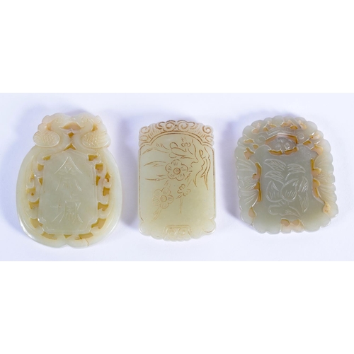 1855 - THREE CHINESE CARVED JADE PLAQUE PENDANTS 20th Century, in various forms and sizes. Largest 5 cm x 5... 