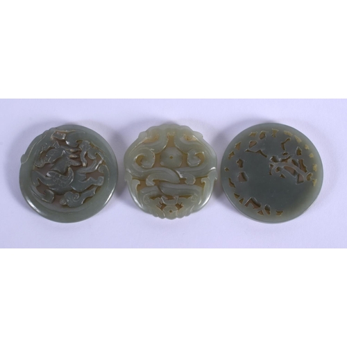 1857 - THREE CHINESE CARVED JADE PLAQUE PENDANTS 20th Century, in various forms and sizes. Largest 5 cm x 5... 