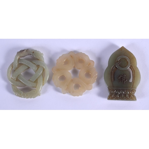 1859 - THREE CHINESE CARVED JADE PLAQUE PENDANTS 20th Century, in various forms and sizes. Largest 5 cm x 5... 