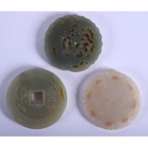 1862 - THREE CHINESE CARVED JADE PLAQUE PENDANTS 20th Century, in various forms and sizes. Largest 5 cm x 5... 