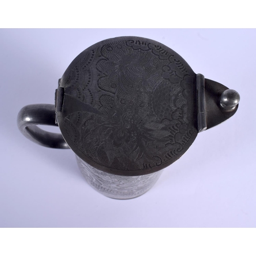 1884 - AN EARLY 20TH CENTURY CHINESE PEWTER KUTHING JUG decorated with dragons. 21 cm high.