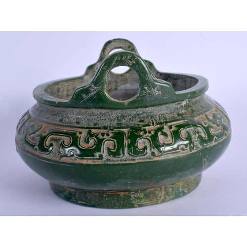 1886 - A CHINESE TWIN HANDLED JADE CENSER 20th Century, decorated with archaic motifs. 13.5 cm wide.