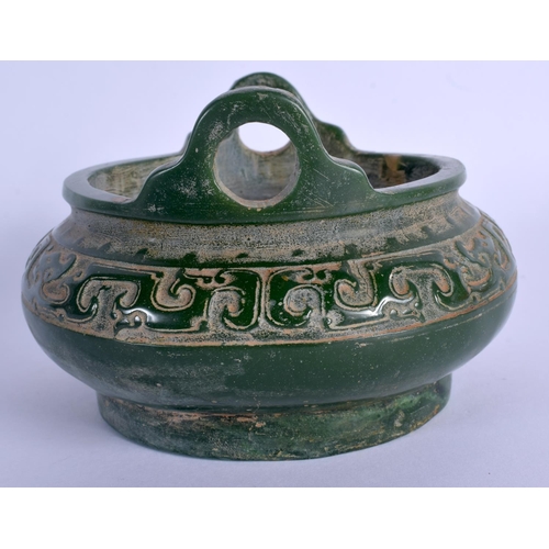 1886 - A CHINESE TWIN HANDLED JADE CENSER 20th Century, decorated with archaic motifs. 13.5 cm wide.