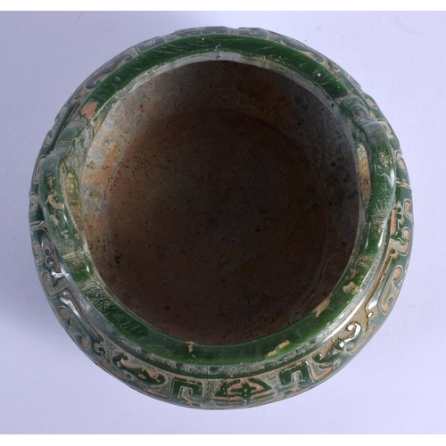 1886 - A CHINESE TWIN HANDLED JADE CENSER 20th Century, decorated with archaic motifs. 13.5 cm wide.