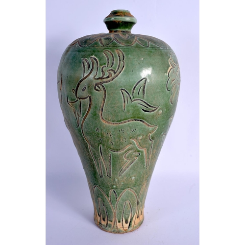 1908 - A CHINESE POTTERY CELADON INCISED VASE 20th Century. 35 cm high.