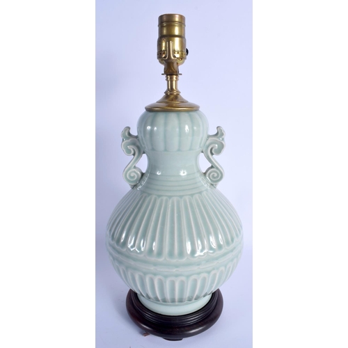 1910 - AN EARLY 20TH CENTURY CHINESE TWIN HANDLED CELADON PORCELAIN VASE Late Qing, converted to a lamp. Po... 