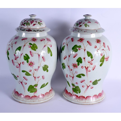 1921 - A VERY RARE PAIR OF MID 19TH CENTURY CHINESE FAMILLE ROSE VASES AND COVERS Qing, unusually painted w... 