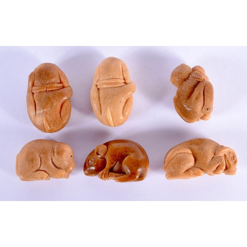 1943 - SIX JAPANESE CARVED TAGUA NUT NETSUKES. (6)