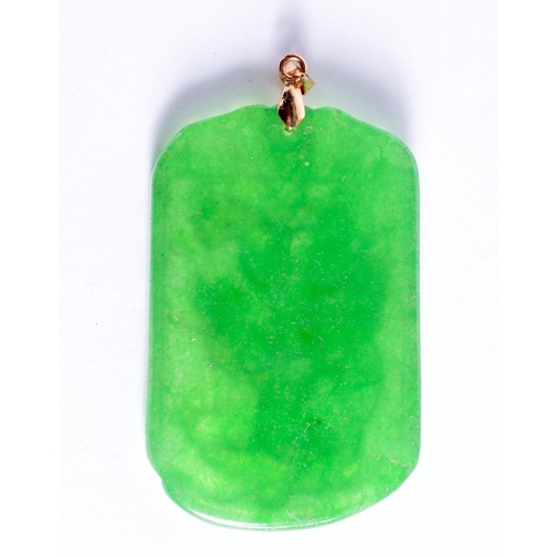 1946 - A CHINESE CARVED JADEITE PENDANT 20th Century. 6.25 cm x 3.25 cm.