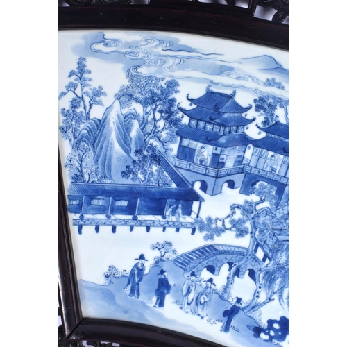 1969 - A LARGE 18TH/19TH CENTURY CHINESE BLUE AND WHITE FAN SHAPED PANEL Qing, painted with figures and lan... 