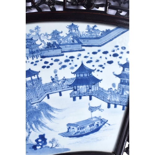 1969 - A LARGE 18TH/19TH CENTURY CHINESE BLUE AND WHITE FAN SHAPED PANEL Qing, painted with figures and lan... 