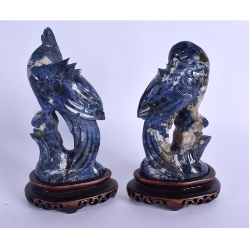 1984 - A PAIR OF EARLY 20TH CENTURY CHINESE CARVED LAPIS LAZULI BIRDS Late Qing, upon hardwood bases. Lapis... 