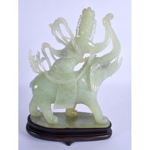 1992 - AN EARLY 19TH CENTURY CHINESE CARVED JADE FIGURE OF AN ELEPHANT modelled being ridden by a buddhisti... 