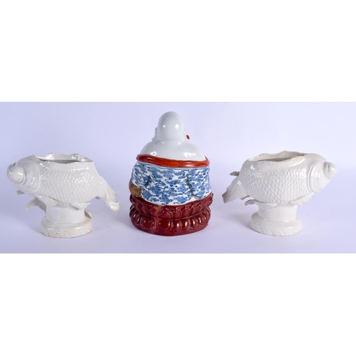 1998 - A PAIR OF EARLY 20TH CENTURY CHINESE BLANC DE CHINE PORCELAIN FISH together with a porcelain buddha.... 