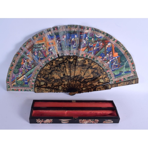 2022 - A 19TH CENTURY CHINESE EXPORT BLACK LACQUER FAN Late Qing, painted with figures within landscapes. 5... 