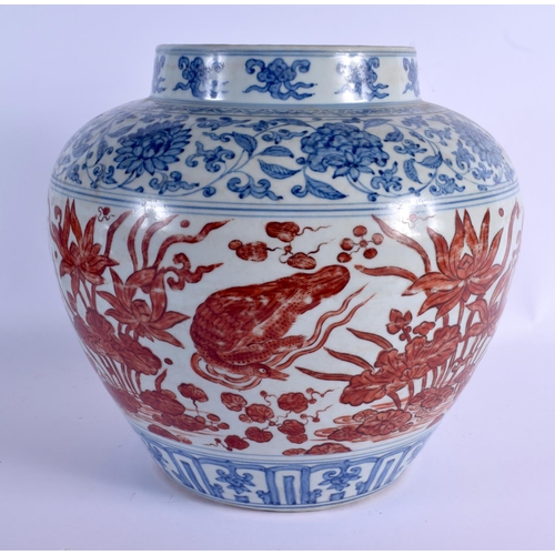 2028 - A VERY LARGE CHINESE QING DYNASTY BLUE AND WHITE VASE Ming style, painted with red ducks and extensi... 