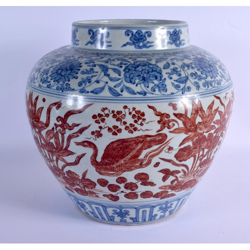 2028 - A VERY LARGE CHINESE QING DYNASTY BLUE AND WHITE VASE Ming style, painted with red ducks and extensi... 