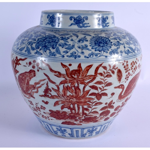 2028 - A VERY LARGE CHINESE QING DYNASTY BLUE AND WHITE VASE Ming style, painted with red ducks and extensi... 