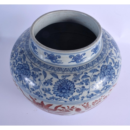 2028 - A VERY LARGE CHINESE QING DYNASTY BLUE AND WHITE VASE Ming style, painted with red ducks and extensi... 