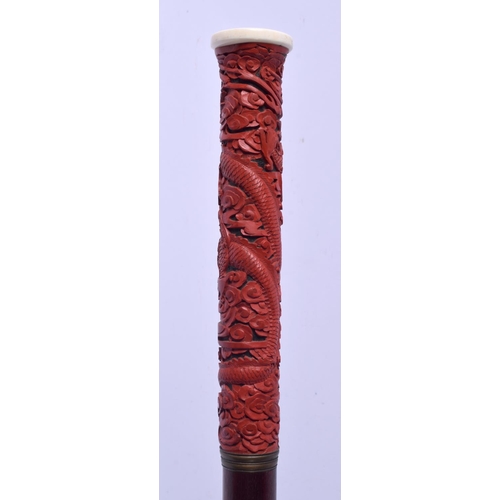 2033 - A 19TH CENTURY CHINESE CARVED CINNABAR LACQUER WALKING CANE Late Qing/Republic. 88 cm long.