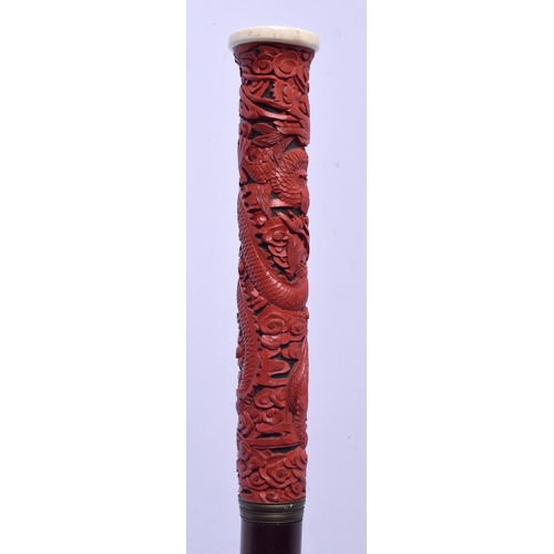 2033 - A 19TH CENTURY CHINESE CARVED CINNABAR LACQUER WALKING CANE Late Qing/Republic. 88 cm long.