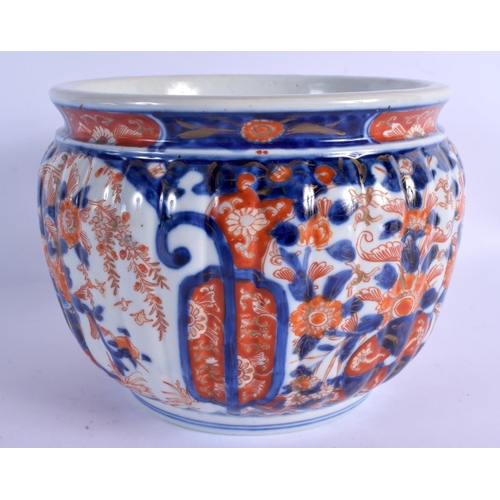 2057 - A 19TH CENTURY JAPANESE MEIJI PERIOD IMARI RIBBED JARDINIERE painted with flowers. 16 cm x 18 cm.