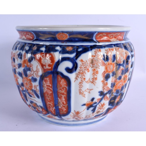 2057 - A 19TH CENTURY JAPANESE MEIJI PERIOD IMARI RIBBED JARDINIERE painted with flowers. 16 cm x 18 cm.