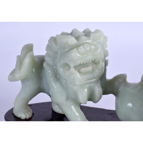 2063 - AN EARLY 20TH CENTURY CHINESE CARVED SOAPSTONE FIGURE OF BUDDHISTIC LIONS Late Qing/Republic. Figure... 