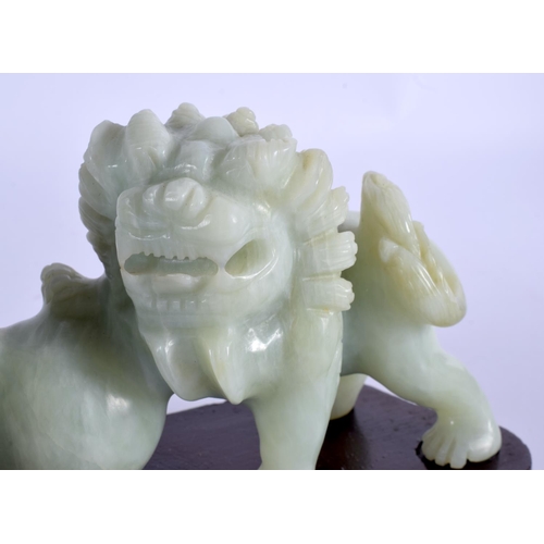 2063 - AN EARLY 20TH CENTURY CHINESE CARVED SOAPSTONE FIGURE OF BUDDHISTIC LIONS Late Qing/Republic. Figure... 