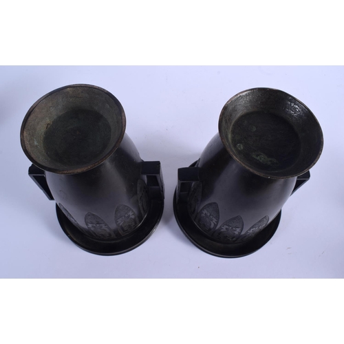 2069 - A 19TH CENTURY JAPANESE MEIJI PERIOD TWIN HANDLED BRONZE VASES of archaic form. 22 cm x 14 cm.