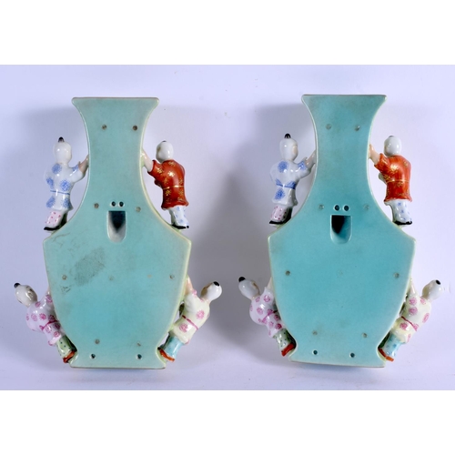 2097 - A PAIR OF EARLY 20TH CENTURY CHINESE FAMILLE ROSE PORCELAIN WALL POCKETS Late Qing/Republic, painted... 