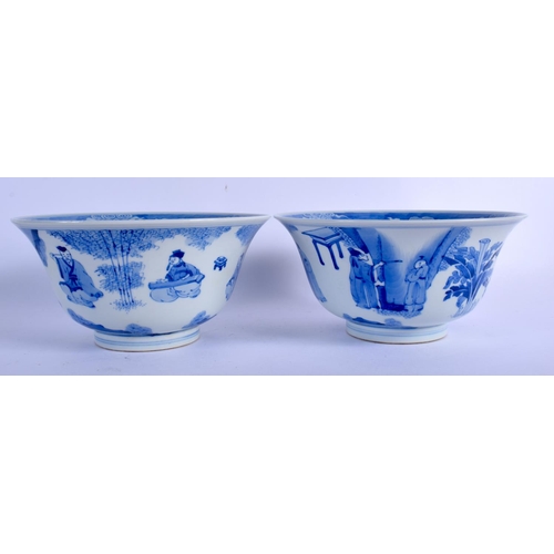 2103 - A PAIR OF CHINESE BLUE AND WHITE PORCELAIN BOWLS 20th Century, Kangxi style, painted with figures wi... 