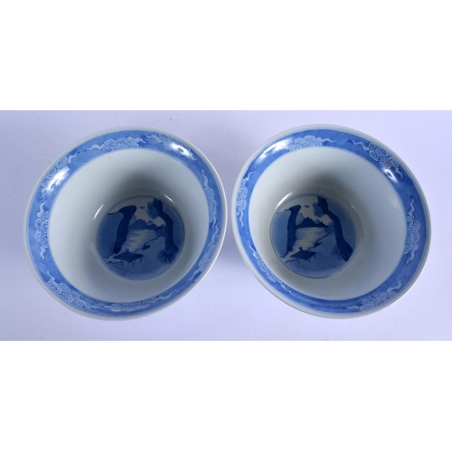 2103 - A PAIR OF CHINESE BLUE AND WHITE PORCELAIN BOWLS 20th Century, Kangxi style, painted with figures wi... 