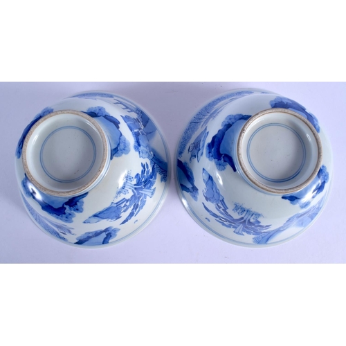 2103 - A PAIR OF CHINESE BLUE AND WHITE PORCELAIN BOWLS 20th Century, Kangxi style, painted with figures wi... 