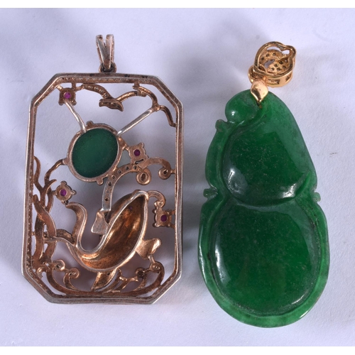 2104 - TWO CHINESE APPLE JADEITE PENDANTS. Largest 4.5 cm x 2.75 cm. (2)