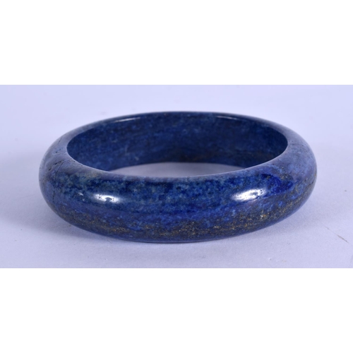 2108 - A CHINESE LAPIS LAZULI CARVED BANGLE 20th Century. 6.5 cm high.