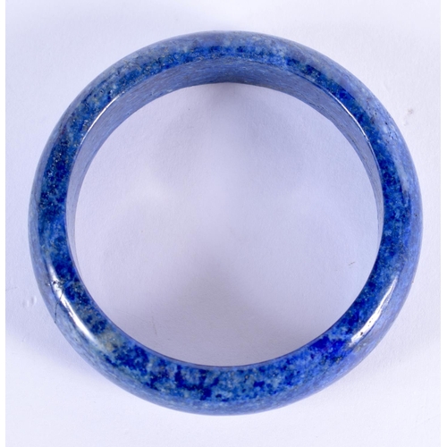 2108 - A CHINESE LAPIS LAZULI CARVED BANGLE 20th Century. 6.5 cm high.