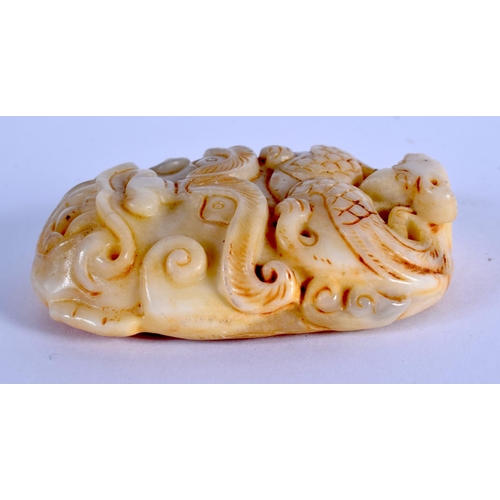 2123 - A CHINESE CARVED ARCHAIC JADE MASK HEAD SLIDING BELT BUCKLE 20th Century. 8.5 cm x 5.5 cm.