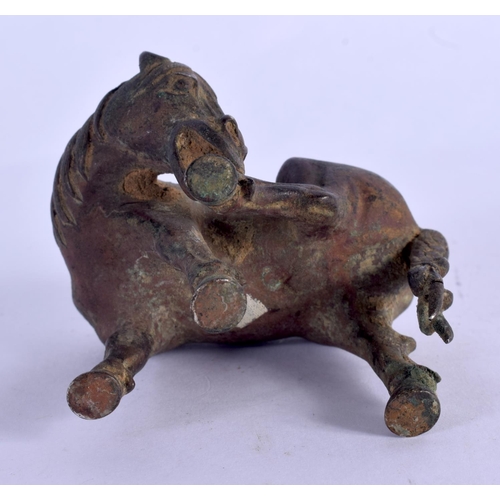 2131 - A 17TH/18TH CENTURY CHINESE BRONZE FIGURE OF A HORSE possibly a scroll weight, Late Ming/Qing, model... 