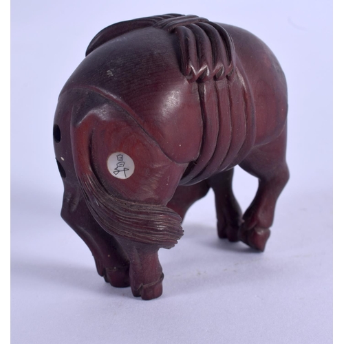 2132 - A JAPANESE CARVED BOXWOOD HORSE NETSUKE. 5 cm x 4 cm.