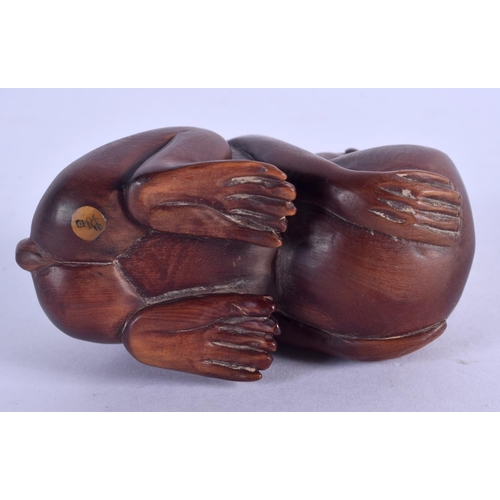 2136 - A JAPANESE CARVED BOXWOOD FIGURE OF A MONKEY OKIMONO. 7 cm x 4.5 cm.