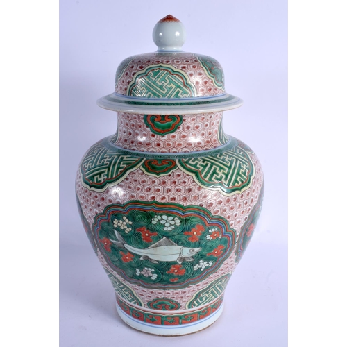 2148 - A LARGE 19TH CENTURY CHINESE WUCAI PORCELAIN VASE AND COVER Qing, enamelled with fish amongst foliag... 